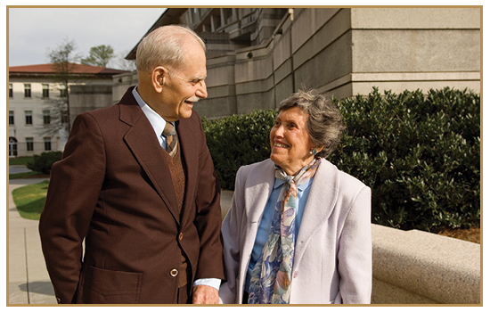 image of rose and gene smiling in front of rollins school of public