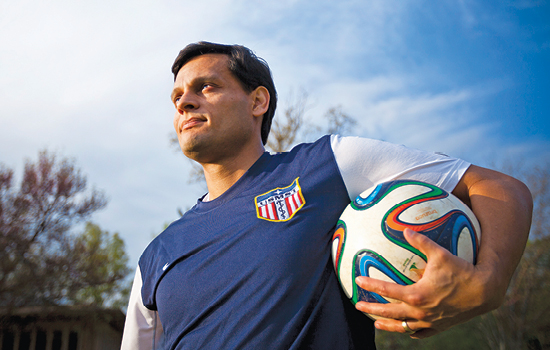 image of felipe lobelo holding a soccer ball.