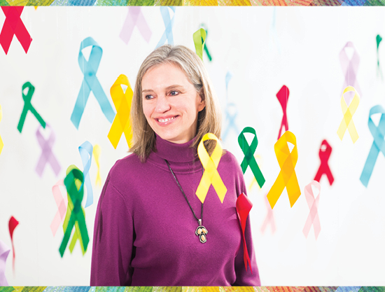 image of michelle kegler being surrounded by colorful cancer ribbons