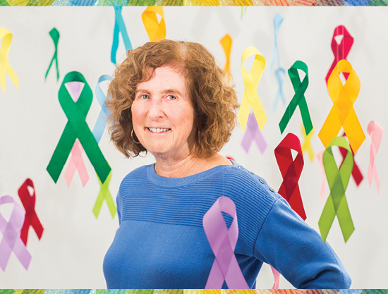 image of joellen schildkraut being surrounded by colorful cancer ribbons