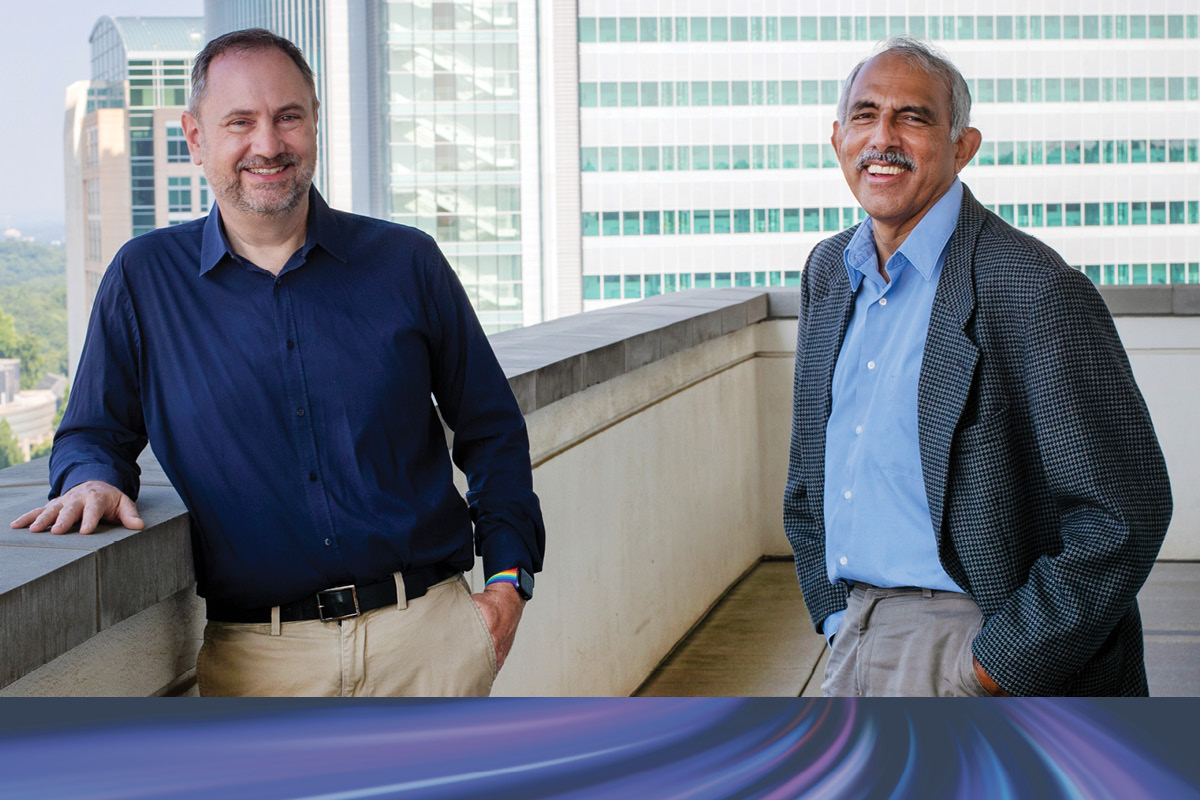 An outdoor photo of Patrick Sullivan and K.M. Venkat Narayan