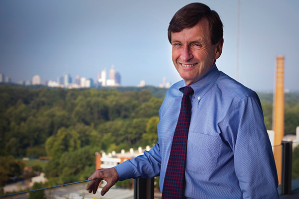 An outdoor portrait of Rollins School of Public Health Dean James Curran